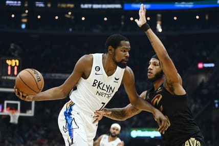 Dec 26, 2022; Cleveland, Ohio, USA; Brooklyn Nets forward Kevin Durant (7) drives to the basket against Cleveland Cavaliers forward Lamar Stevens (8) during the first half at Rocket Mortgage FieldHouse. Mandatory Credit: Ken Blaze-USA TODAY Sports