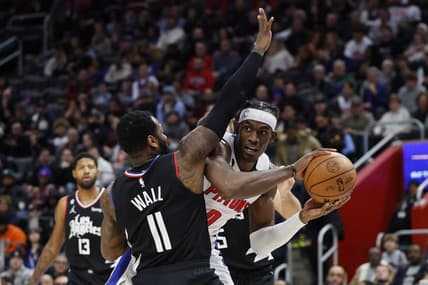 Dec 26, 2022; Detroit, Michigan, USA;  Detroit Pistons center Jalen Duren (0) is defended by LA Clippers guard John Wall (11) in the first half at Little Caesars Arena. Mandatory Credit: Rick Osentoski-USA TODAY Sports