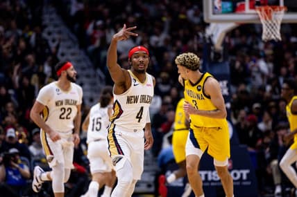 Dec 26, 2022; New Orleans, Louisiana,  USA;  New Orleans Pelicans guard Devonte' Graham (4) reacts to making a three point basket against Indiana Pacers guard Chris Duarte (3) during the first half at Smoothie King Center. Mandatory Credit: Stephen Lew-USA TODAY Sports
