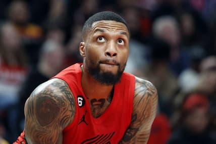 Dec 26, 2022; Portland, Oregon, USA; Portland Trail Blazers point guard Damian Lillard (0) looks on during the first half against the Charlotte Hornets at Moda Center. Mandatory Credit: Soobum Im-USA TODAY Sports