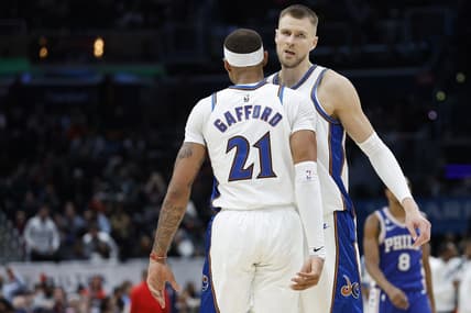 Dec 27, 2022; Washington, District of Columbia, USA; Washington Wizards center Kristaps Porzingis (6) celebrates with Wizards center Daniel Gafford (21) in the final seconds against the Philadelphia 76ers in the fourth quarter at Capital One Arena. Mandatory Credit: Geoff Burke-USA TODAY Sports