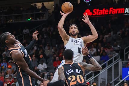 Dec 28, 2022; Atlanta, Georgia, USA; Brooklyn Nets guard Ben Simmons (10) shoots over Atlanta Hawks forward John Collins (20) in the first quarter at State Farm Arena. Mandatory Credit: Brett Davis-USA TODAY Sports
