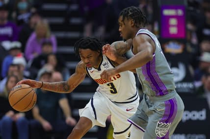 Dec 28, 2022; Sacramento, California, USA; Denver Nuggets guard Bones Hyland (3) dribbles the ball against Sacramento Kings guard Davion Mitchell (15) during the first quarter at Golden 1 Center. Mandatory Credit: Sergio Estrada-USA TODAY Sports