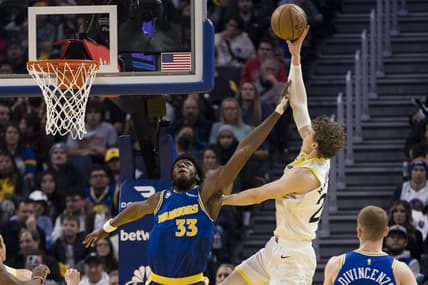 Dec 28, 2022; San Francisco, California, USA; Golden State Warriors center James Wiseman (33) fouls Utah Jazz forward Lauri Markkanen (23) during the first half at Chase Center. Mandatory Credit: John Hefti-USA TODAY Sports