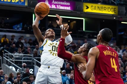 Dec 29, 2022; Indianapolis, Indiana, USA; Indiana Pacers guard Bennedict Mathurin (00) shoots the ball while Cleveland Cavaliers forward Isaac Okoro (35) defends at Gainbridge Fieldhouse. Mandatory Credit: Trevor Ruszkowski-USA TODAY Sports