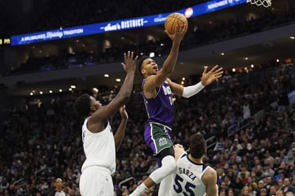 Dec 30, 2022; Milwaukee, Wisconsin, USA;  Milwaukee Bucks forward Giannis Antetokounmpo (34) shoots over Minnesota Timberwolves center Luka Garza (55) during the second quarter at Fiserv Forum. Mandatory Credit: Jeff Hanisch-USA TODAY Sports