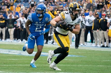 Iowa defensive back Cooper DeJean (3) pulls in an interception for a touchdown over Kentucky wide receiver Barion Brown (2) during the second quarter of the TransPerfect Music City Bowl at Nissan Stadium Saturday, Dec. 31, 2022, in Nashville, Tenn.

Ncaa Football Music City Bowl Iowa At Kentucky