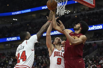 Dec 31, 2022; Chicago, Illinois, USA;  Chicago Bulls forward Javonte Green (24) and Chicago Bulls center Nikola Vucevic (9) fight for a rebound against Cleveland Cavaliers center Jarrett Allen (31) during the first half at United Center. Mandatory Credit: Matt Marton-USA TODAY Sports