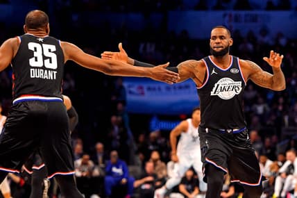 Feb 17, 2019; Charlotte, NC, USA; Team Lebron forward Lebron James of the Los Angeles Lakers (23) reacts with Team Lebron forward Kevin Durant of the Golden State Warrior (35) during the 2019 NBA All-Star Game at Spectrum Center. Mandatory Credit: Bob Donnan-USA TODAY Sports