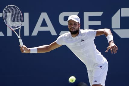 Aug 29, 2019; Flushing, NY, USA; Gregoire Barrere of France hits a forehand against David Goffin of Belgium (not pictured) in the second round on day four of the 2019 U.S. Open tennis tournament at USTA Billie Jean King National Tennis Center. Mandatory Credit: Geoff Burke-USA TODAY Sports