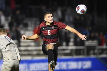 Dec 13, 2019; Cary, NC, USA; Stanford Cardinal defender Keegan Hughes (5) heads the ball in the second half at WakeMed Soccer Park. Mandatory Credit: Bob Donnan-USA TODAY Sports