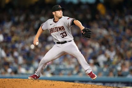 Jul 9, 2021; Los Angeles, California, USA; Arizona Diamondbacks starting pitcher J.B. Bukauskas (33) delivers a pitch against the Los Angeles Dodgers at Dodger Stadium. Mandatory Credit: Kirby Lee-USA TODAY Sports