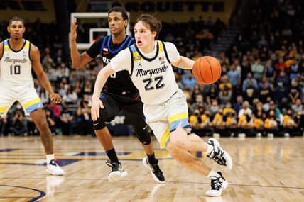 Jan 11, 2022; Milwaukee, Wisconsin, USA;  Marquette Golden Eagles guard Tyler Kolek (22) drives for the basket during the first half against the DePaul Blue Demons at Fiserv Forum. Mandatory Credit: Jeff Hanisch-USA TODAY Sports