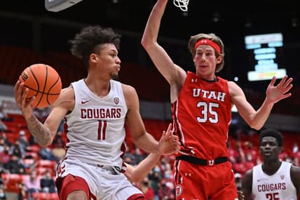 Jan 26, 2022; Pullman, Washington, USA; Washington State Cougars forward D.J. Rodman (11) passes the ball against Utah Utes center Branden Carlson (35) in the second half at Friel Court at Beasley Coliseum. Washington State won 71-54. Mandatory Credit: James Snook-USA TODAY Sports