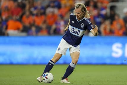 Jul 13, 2022; Cincinnati, Ohio, USA; Vancouver Whitecaps' Florian Jungwirth (26) dribbles against FC Cincinnati in the second half at TQL Stadium. Mandatory Credit: Katie Stratman-USA TODAY Sports