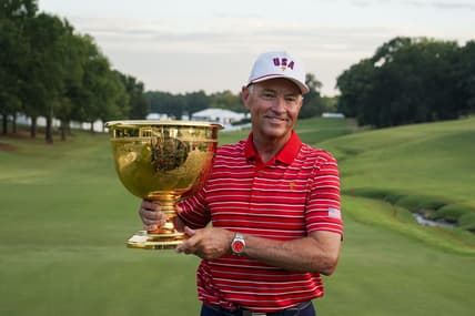 Sep 25, 2022; Charlotte, North Carolina, USA; Team USA captain Davis Love III poses for a photo with the trophy during the singles match play of the Presidents Cup golf tournament at Quail Hollow Club. Mandatory Credit: Peter Casey-USA TODAY Sports
