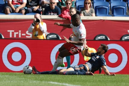 Oct 15, 2022; Harrison, New Jersey, USA; FC Cincinnati defender Matt Miazga (21) slide tackles New York Red Bulls forward Elias Manoel (11) during the second half at Red Bull Arena. Mandatory Credit: Vincent Carchietta-USA TODAY Sports