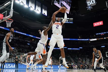 Dec 4, 2022; San Antonio, Texas, USA;  Phoenix Suns forward Josh Okogie (2) rebounds in the second half against the San Antonio Spurs at the AT&T Center. Mandatory Credit: Daniel Dunn-USA TODAY Sports