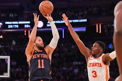 Dec 7, 2022; New York, New York, USA;  New York Knicks guard Jalen Brunson (11) pulls up for a jump shot defended by Atlanta Hawks guard Aaron Holiday (3) during the fourth quarter  at Madison Square Garden. Mandatory Credit: Dennis Schneidler-USA TODAY Sports