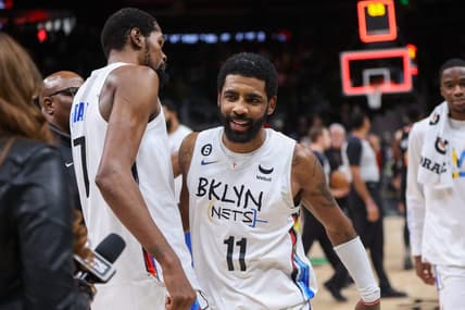 Dec 28, 2022; Atlanta, Georgia, USA; Brooklyn Nets forward Kevin Durant (7) and guard Kyrie Irving (11) celebrate after a victory against the Atlanta Hawks at State Farm Arena. Mandatory Credit: Brett Davis-USA TODAY Sports