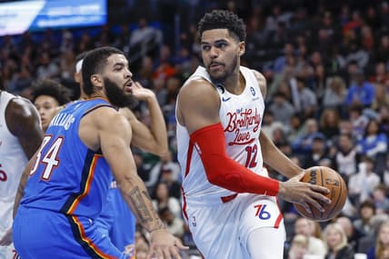 Dec 31, 2022; Oklahoma City, Oklahoma, USA; Philadelphia 76ers forward Tobias Harris (12) drives around Oklahoma City Thunder forward Kenrich Williams (34) during the second quarter at Paycom Center. Mandatory Credit: Alonzo Adams-USA TODAY Sports