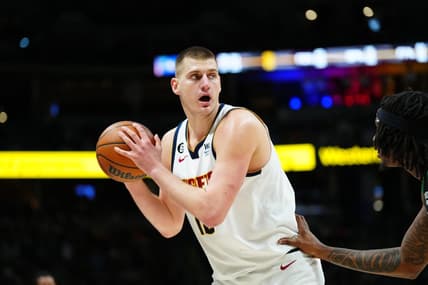 Jan 1, 2023; Denver, Colorado, USA; Denver Nuggets center Nikola Jokic (15) controls the ball in the second quarter against the Boston Celtics at Ball Arena. Mandatory Credit: Ron Chenoy-USA TODAY Sports