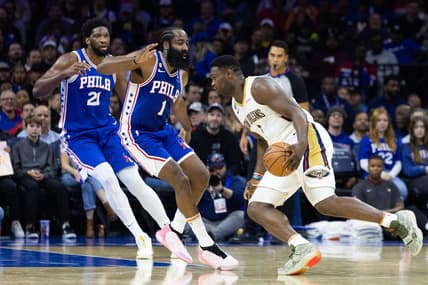 Jan 2, 2023; Philadelphia, Pennsylvania, USA; New Orleans Pelicans forward Zion Williamson (1) drives against Philadelphia 76ers guard James Harden (1) and center Joel Embiid (21) during the second quarter at Wells Fargo Center. Mandatory Credit: Bill Streicher-USA TODAY Sports