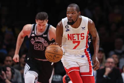 Jan 2, 2023; Brooklyn, New York, USA; Brooklyn Nets forward Kevin Durant (7) dribbles up court in front of San Antonio Spurs forward Zach Collins (23) during the first half at Barclays Center. Mandatory Credit: Vincent Carchietta-USA TODAY Sports
