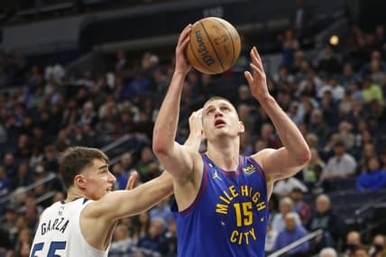 Jan 2, 2023; Minneapolis, Minnesota, USA; Denver Nuggets center Nikola Jokic (15) works around Minnesota Timberwolves center Luka Garza (55) in the first quarter at Target Center. Mandatory Credit: Bruce Kluckhohn-USA TODAY Sports