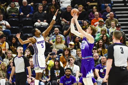 Jan 3, 2023; Salt Lake City, Utah, USA; Utah Jazz forward Lauri Markkanen (23) takes a shot over Sacramento Kings guard De'Aaron Fox (5) during the first quarter at Vivint Arena. Mandatory Credit: Christopher Creveling-USA TODAY Sports