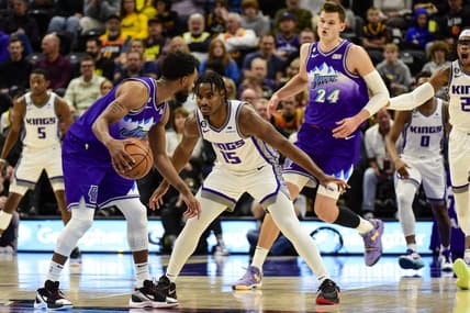 Jan 3, 2023; Salt Lake City, Utah, USA; Sacramento Kings guard Davion Mitchell (15) defends Utah Jazz guard Mike Conley (11) during the first quarter at Vivint Arena. Mandatory Credit: Christopher Creveling-USA TODAY Sports
