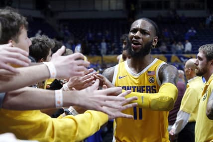 Jan 3, 2023; Pittsburgh, Pennsylvania, USA; Pittsburgh Panthers guard Jamarius Burton (11) celebrates with the PITT student section after defeating the Virginia Cavaliers at the Petersen Events Center. Mandatory Credit: Charles LeClaire-USA TODAY Sports