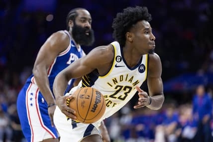 Jan 4, 2023; Philadelphia, Pennsylvania, USA; Indiana Pacers forward Aaron Nesmith (23) dribbles with the ball in front of Philadelphia 76ers guard James Harden (1) during the second quarter at Wells Fargo Center. Mandatory Credit: Bill Streicher-USA TODAY Sports