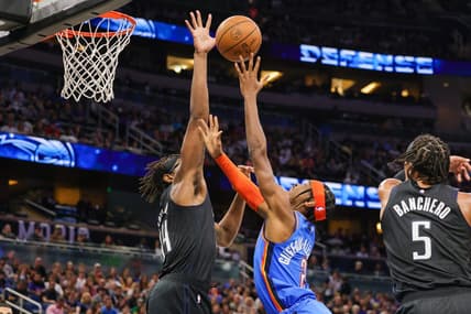 Jan 4, 2023; Orlando, Florida, USA; Orlando Magic center Wendell Carter Jr. (34) blocks a shot by Oklahoma City Thunder guard Shai Gilgeous-Alexander (2) during the second quarter at Amway Center. Mandatory Credit: Mike Watters-USA TODAY Sports