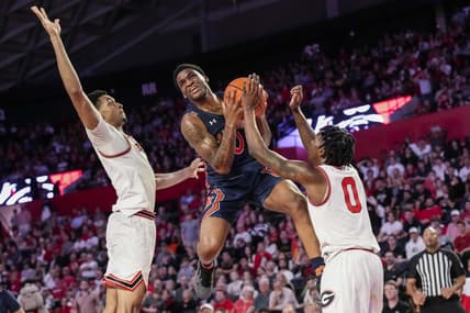 Jan 4, 2023; Athens, Georgia, USA; Auburn Tigers guard K.D. Johnson (0) tries to get past Georgia Bulldogs guard Terry Roberts (0) during the first half at Stegeman Coliseum. Mandatory Credit: Dale Zanine-USA TODAY Sports