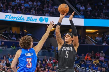 Jan 4, 2023; Orlando, Florida, USA; Orlando Magic forward Paolo Banchero (5) shoots the ball over Oklahoma City Thunder guard Josh Giddey (3) during the second half at Amway Center. Mandatory Credit: Mike Watters-USA TODAY Sports
