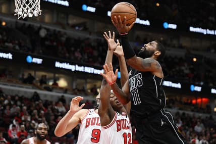 Jan 4, 2023; Chicago, Illinois, USA; Brooklyn Nets guard Kyrie Irving (11) shoots in the second half against Chicago Bulls guard Ayo Dosunmu (12) at United Center. Mandatory Credit: Quinn Harris-USA TODAY Sports