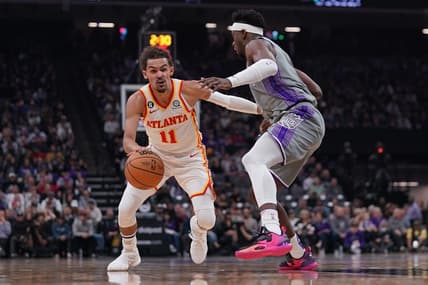 Jan 4, 2023; Sacramento, California, USA; Atlanta Hawks guard Trae Young (11) dribbles past Sacramento Kings guard Terence Davis (3) in the first quarter at the Golden 1 Center. Mandatory Credit: Cary Edmondson-USA TODAY Sports