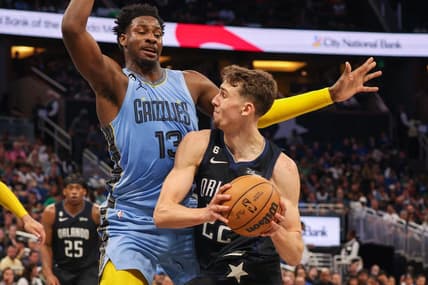 Jan 5, 2023; Orlando, Florida, USA;  Orlando Magic forward Franz Wagner (22) drives to the basket past Memphis Grizzlies forward Jaren Jackson Jr. (13) in the second quarter at Amway Center. Mandatory Credit: Nathan Ray Seebeck-USA TODAY Sports