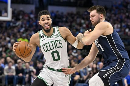 Jan 5, 2023; Dallas, Texas, USA; Boston Celtics forward Jayson Tatum (0) looks to move the ball past Dallas Mavericks guard Luka Doncic (77) during the second quarter at the American Airlines Center. Mandatory Credit: Jerome Miron-USA TODAY Sports