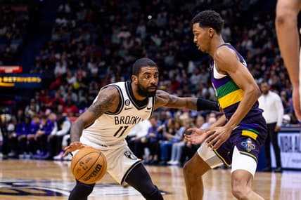 Jan 6, 2023; New Orleans, Louisiana, USA;  Brooklyn Nets guard Kyrie Irving (11) dribbles against New Orleans Pelicans guard Trey Murphy III (25) during the first half  at Smoothie King Center. Mandatory Credit: Stephen Lew-USA TODAY Sports