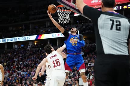 Jan 6, 2023; Denver, Colorado, USA; Denver Nuggets forward Aaron Gordon (50) shoots the ball over Cleveland Cavaliers forward Cedi Osman (16) in the second quarter at Ball Arena. Mandatory Credit: Ron Chenoy-USA TODAY Sports