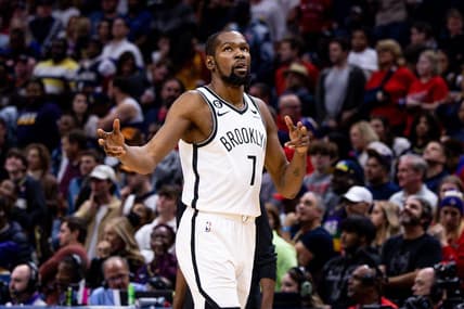 Jan 6, 2023; New Orleans, Louisiana, USA;  Brooklyn Nets forward Kevin Durant (7) reacts to guard Kyrie Irving (11) making a three point basket against the New Orleans Pelicans during the second half at Smoothie King Center. Mandatory Credit: Stephen Lew-USA TODAY Sports