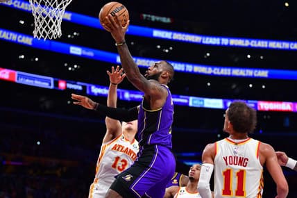 Jan 6, 2023; Los Angeles, California, USA; Los Angeles Lakers forward LeBron James (6) moves to the basket against Atlanta Hawks guard Bogdan Bogdanovic (13) and guard Trae Young (11) during the second half at Crypto.com Arena. Mandatory Credit: Gary A. Vasquez-USA TODAY Sports