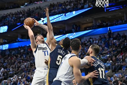 Jan 7, 2023; Dallas, Texas, USA; Dallas Mavericks guard Luka Doncic (77) shoots over New Orleans Pelicans forward Herbert Jones (5) and center Jonas Valanciunas (17) during the first quarter at the American Airlines Center. Mandatory Credit: Jerome Miron-USA TODAY Sports