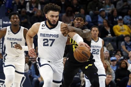 Jan 8, 2023; Memphis, Tennessee, USA; Memphis Grizzlies forward David Roddy (27) drives up the court as Utah Jazz forward Jarred Vanderbilt (8) defends during the first half at FedExForum. Mandatory Credit: Petre Thomas-USA TODAY Sports