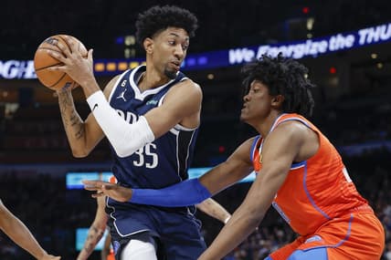 Jan 8, 2023; Oklahoma City, Oklahoma, USA; Dallas Mavericks forward Christian Wood (35) is defended by Oklahoma City Thunder forward Jalen Williams (8) on a drive during the first quarter at Paycom Center. Mandatory Credit: Alonzo Adams-USA TODAY Sports