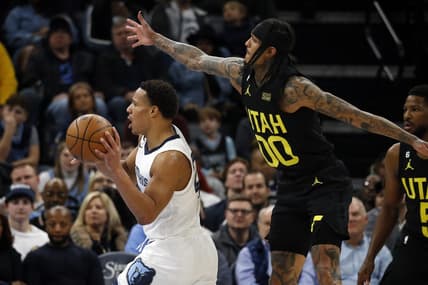 Jan 8, 2023; Memphis, Tennessee, USA; Memphis Grizzlies guard Desmond Bane (22) passes the ball as Utah Jazz guard Jordan Clarkson (00) defends during the second half at FedExForum. Mandatory Credit: Petre Thomas-USA TODAY Sports