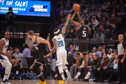 Jan 9, 2023; Sacramento, California, USA; Sacramento Kings guard De'Aaron Fox (5) takes a three point shot over Orlando Magic guard Markelle Fultz (20) during the first quarter at Golden 1 Center. Mandatory Credit: Ed Szczepanski-USA TODAY Sports