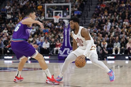 Jan 10, 2023; Salt Lake City, Utah, USA;  Cleveland Cavaliers guard Donovan Mitchell (45) keeps the ball from Utah Jazz forward Simone Fontecchio (16) during the second quarter at Vivint Arena. Mandatory Credit: Chris Nicoll-USA TODAY Sports